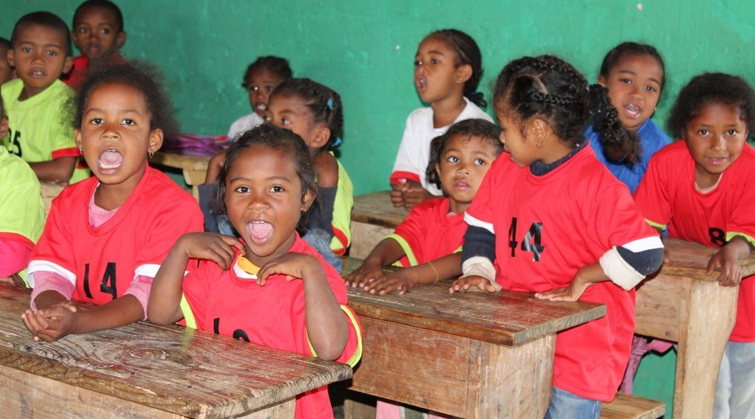 Children sit in their desks while a volunteer is teaching in Madagascar Students sitting in their desks at our volunteer teaching placements in Madagascar